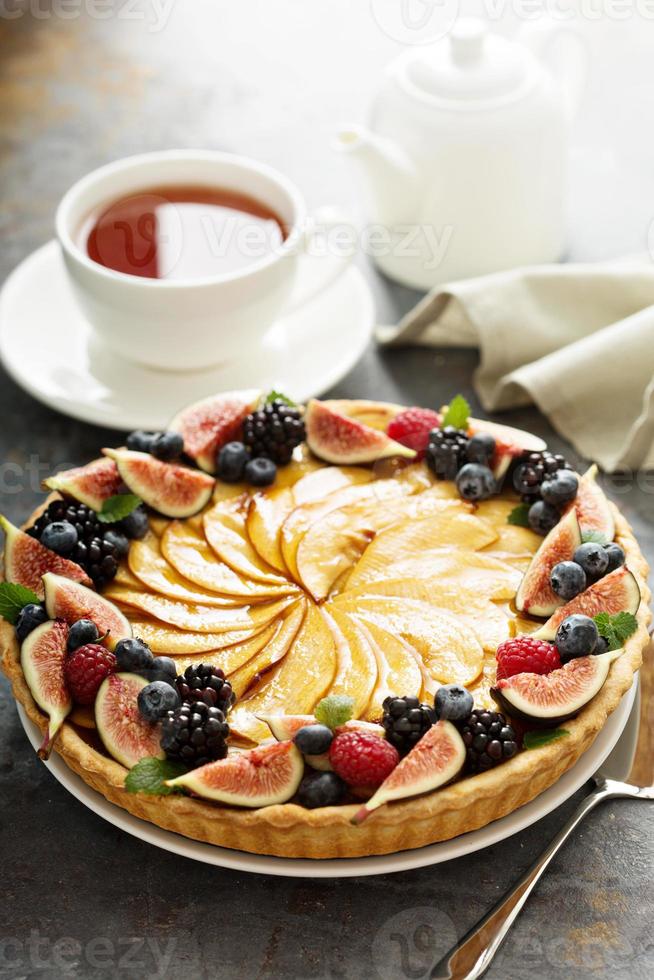 French apple tart decorated with berry photo