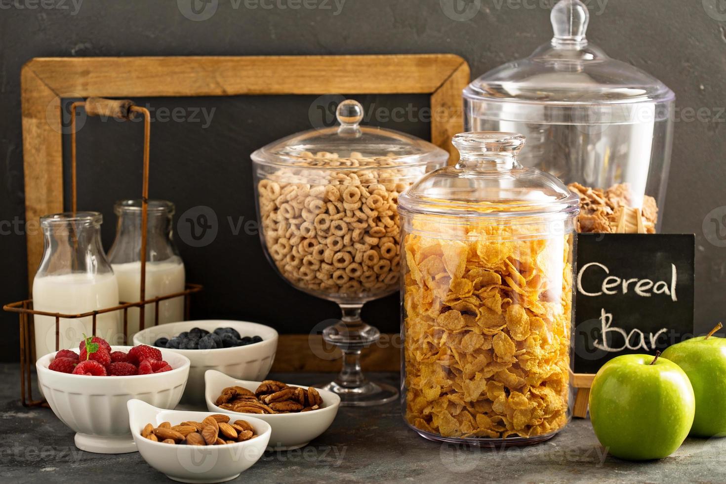 Cereal bar or buffet wih cornflakes, fruit and nuts photo