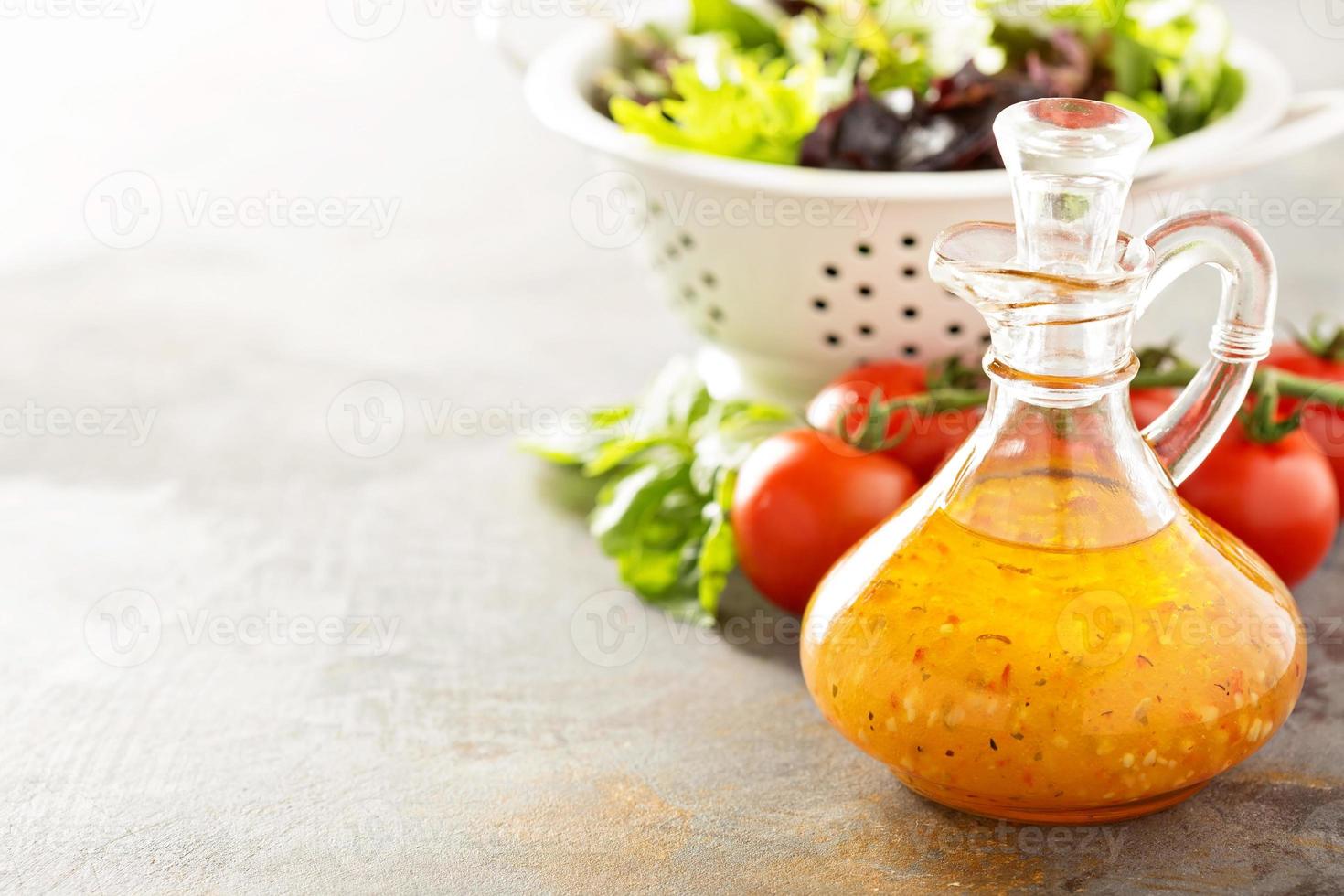 Italian vinaigrette dressing in a vintage bottle photo