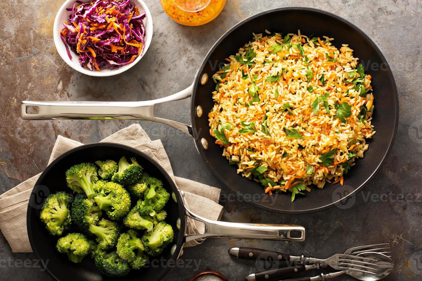 Fried rice with vegetables and steamed broccoli photo
