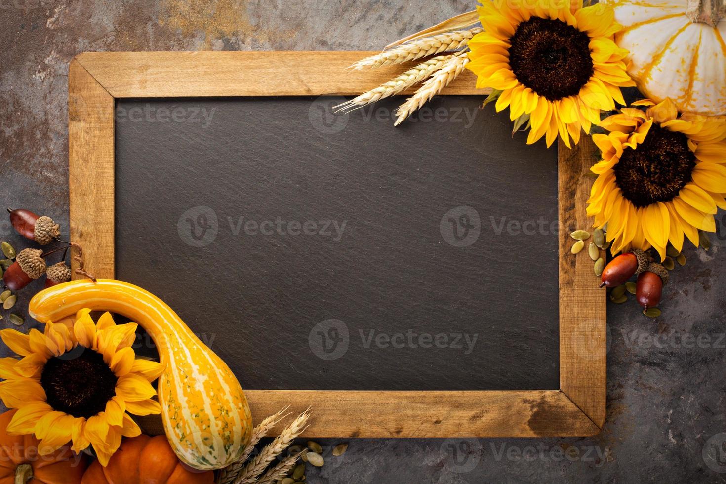 Fall chalkboard frame with pumpkins photo