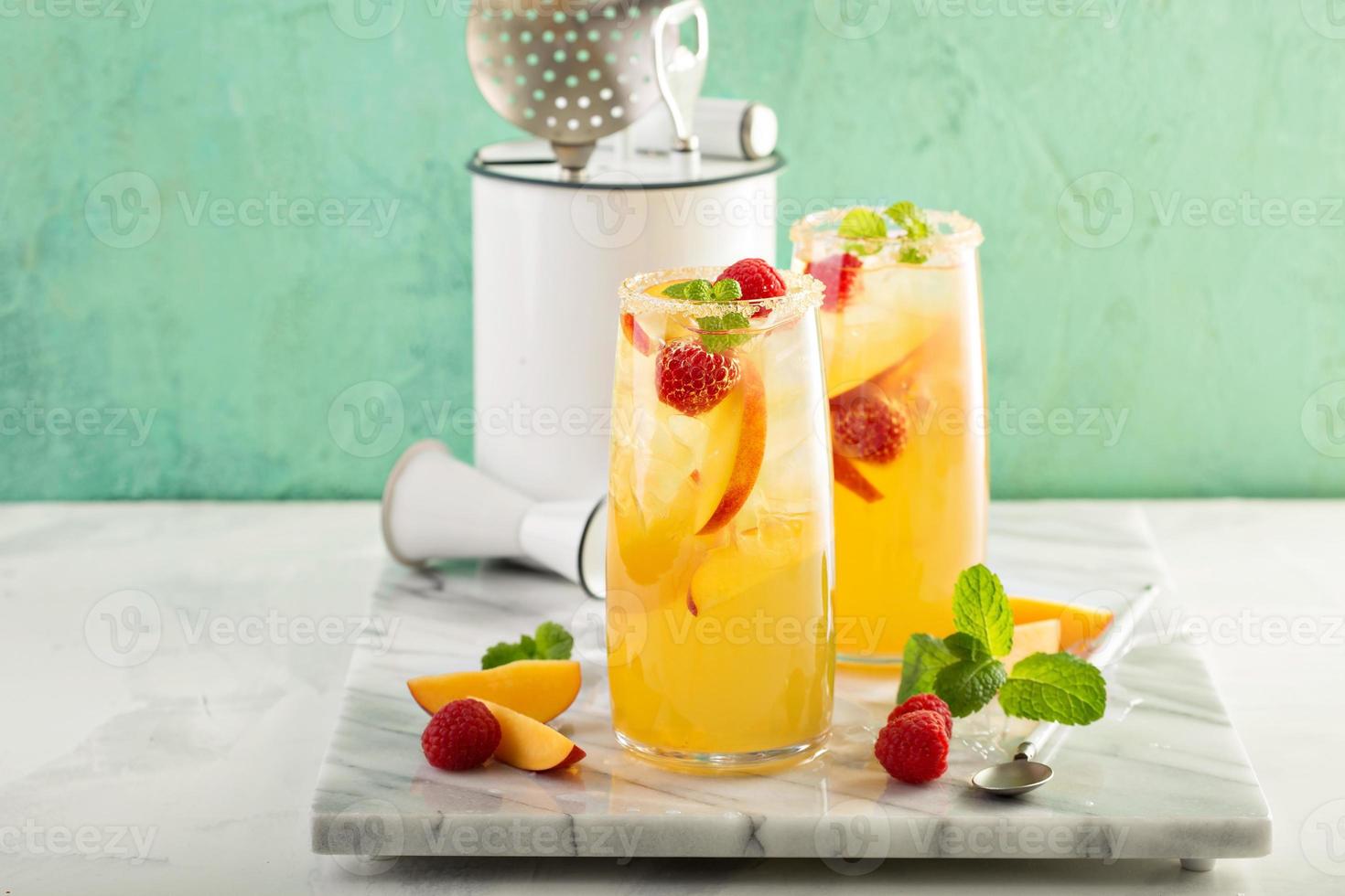 Colorful refreshing cold summer drink with peaches photo