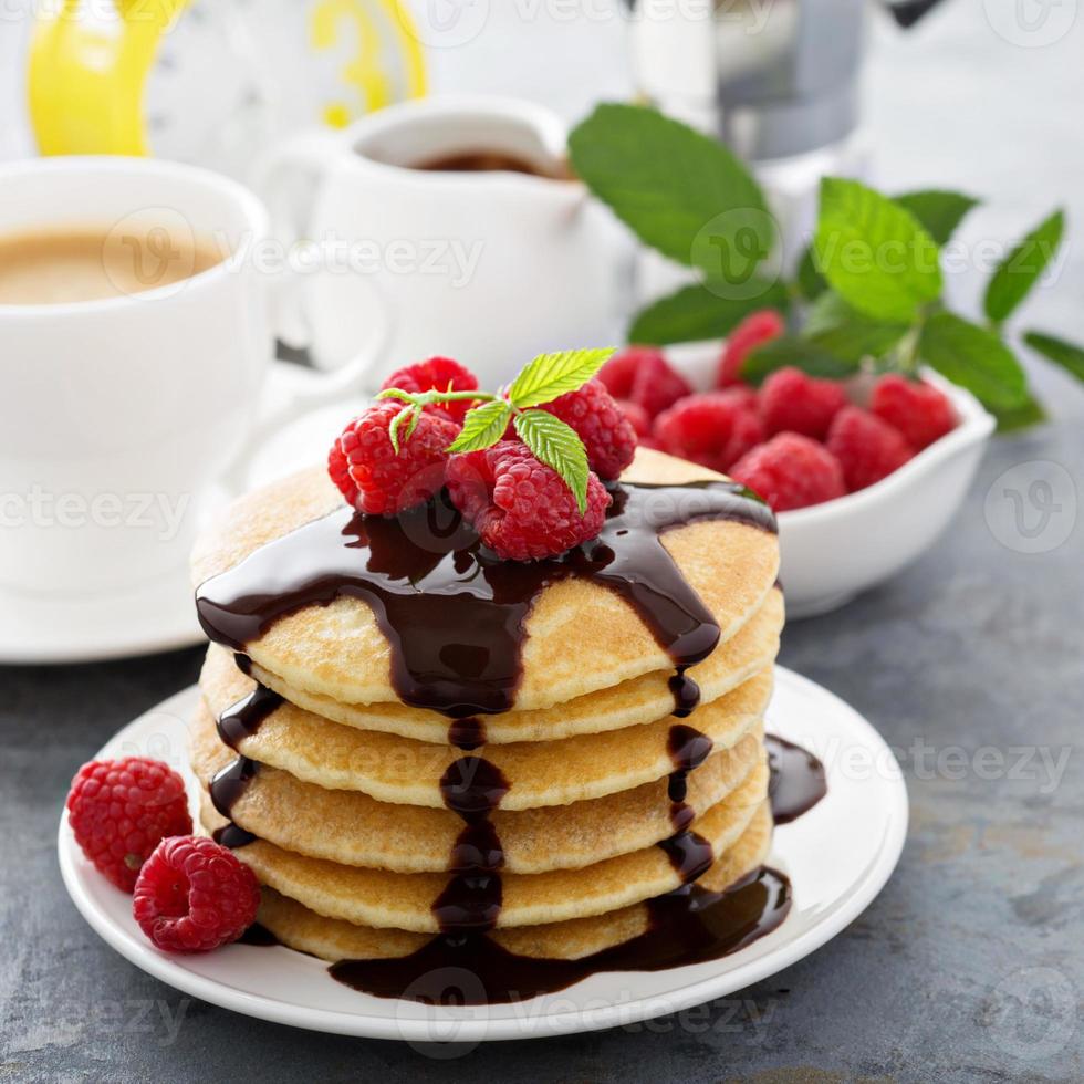 Stack of fluffy buttermilk pancakes with chocolate photo