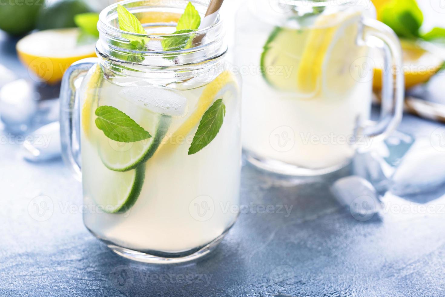 Fresh citrus lemonade in mason jars photo