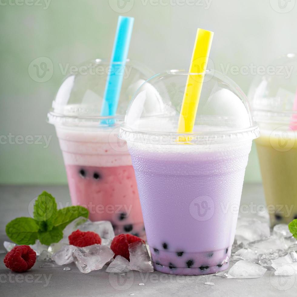 Variety of bubble tea in plastic cups photo