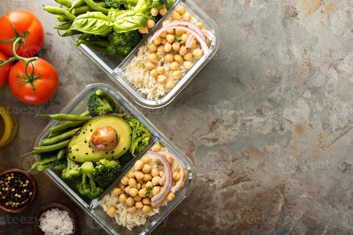 Vegan meal prep containers with cooked rice and chickpeas photo