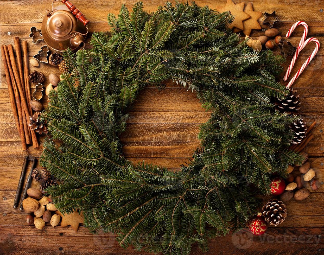 Christmas pine wreath with spices and candy cones photo