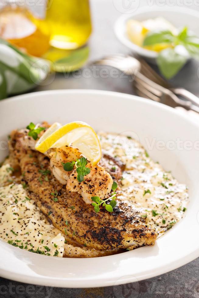 Grits with fried fish and shrimp photo