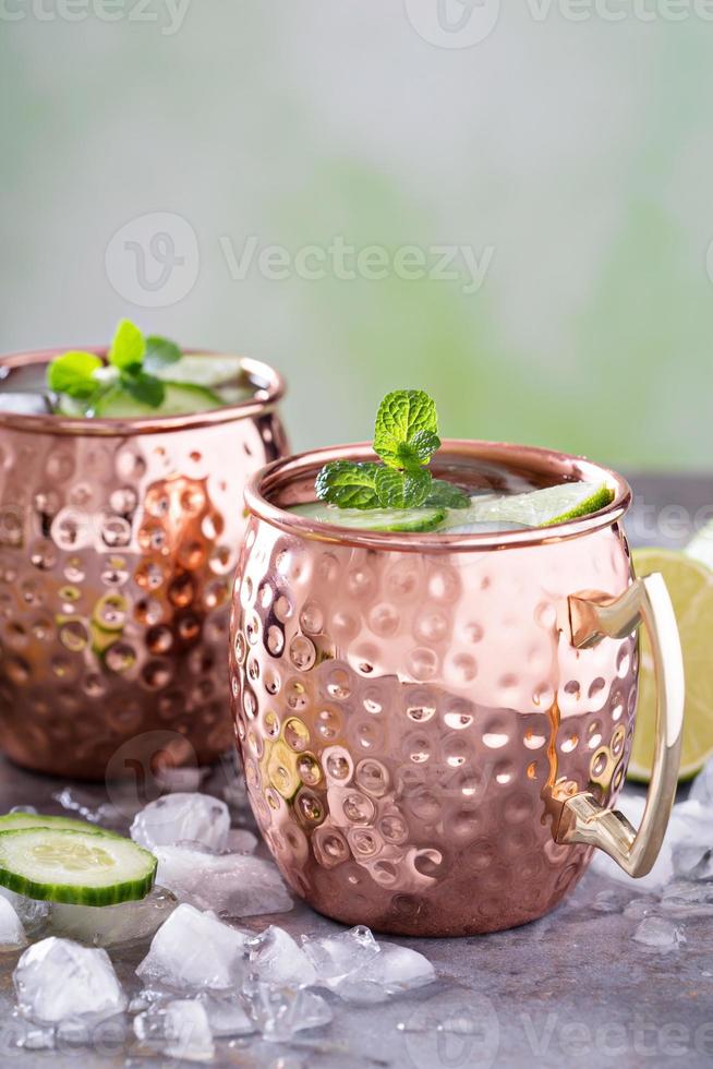 Moscow mule cocktail with lime and cucumber photo