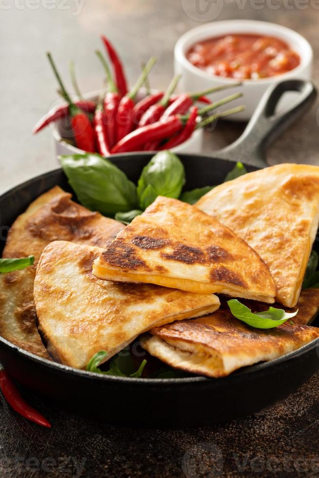 Cheese quesadillas in a cast iron pan photo