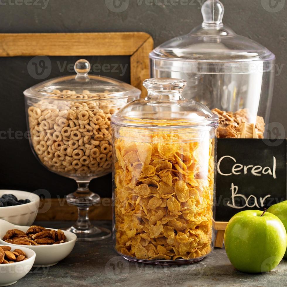 Cereal bar or buffet wih cornflakes, fruit and nuts photo