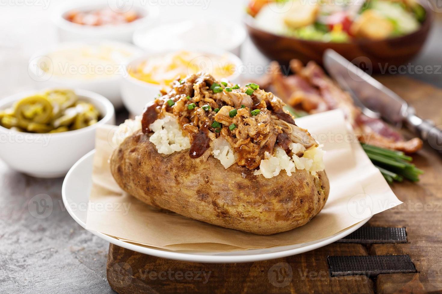 Baked potato with pulled pork photo