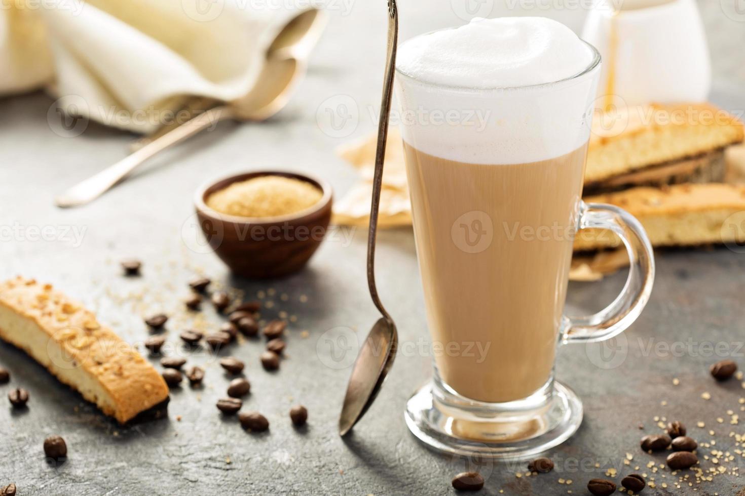 Hot coffee latte with biscotti cookies photo