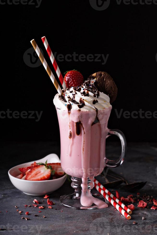 Strawberry milkshake with whipped cream photo