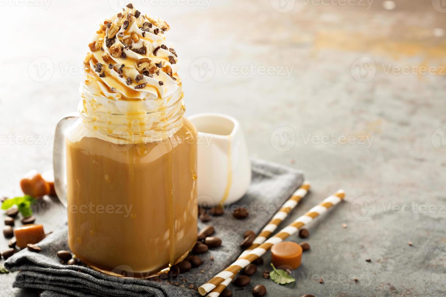 Caramel iced latte with whipped cream photo