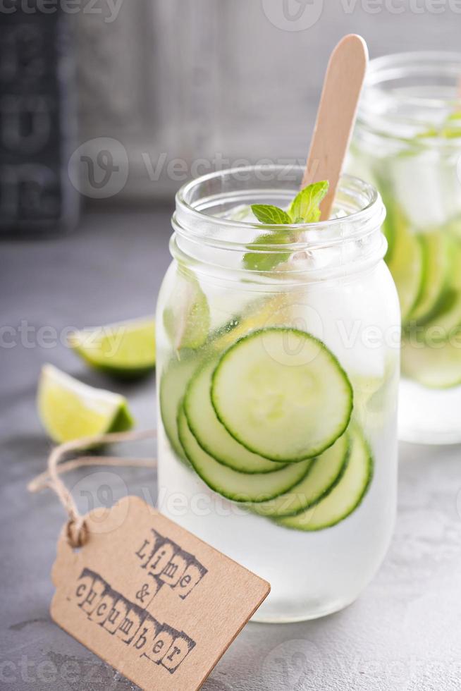 Lime and cucumber lemonade in mason jars photo