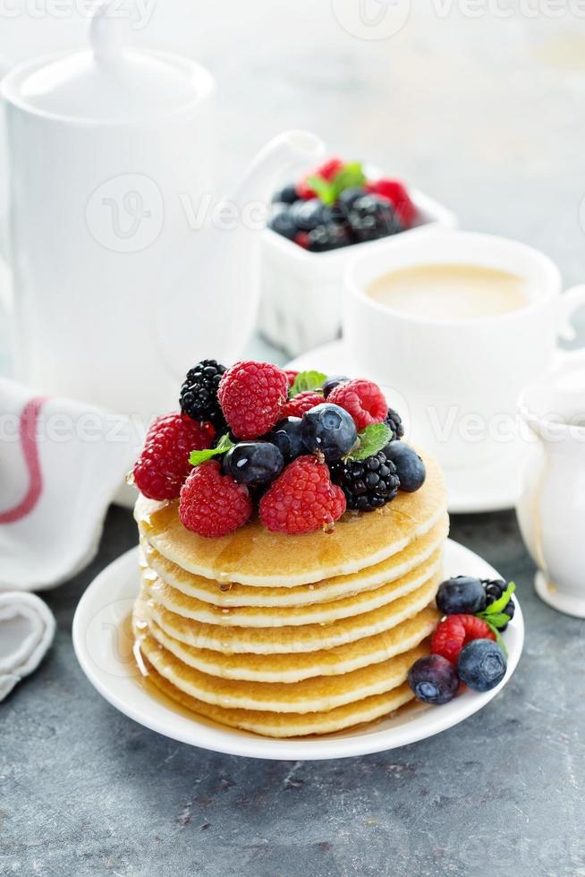 Stack of buttermilk pancakes with fresh berries photo