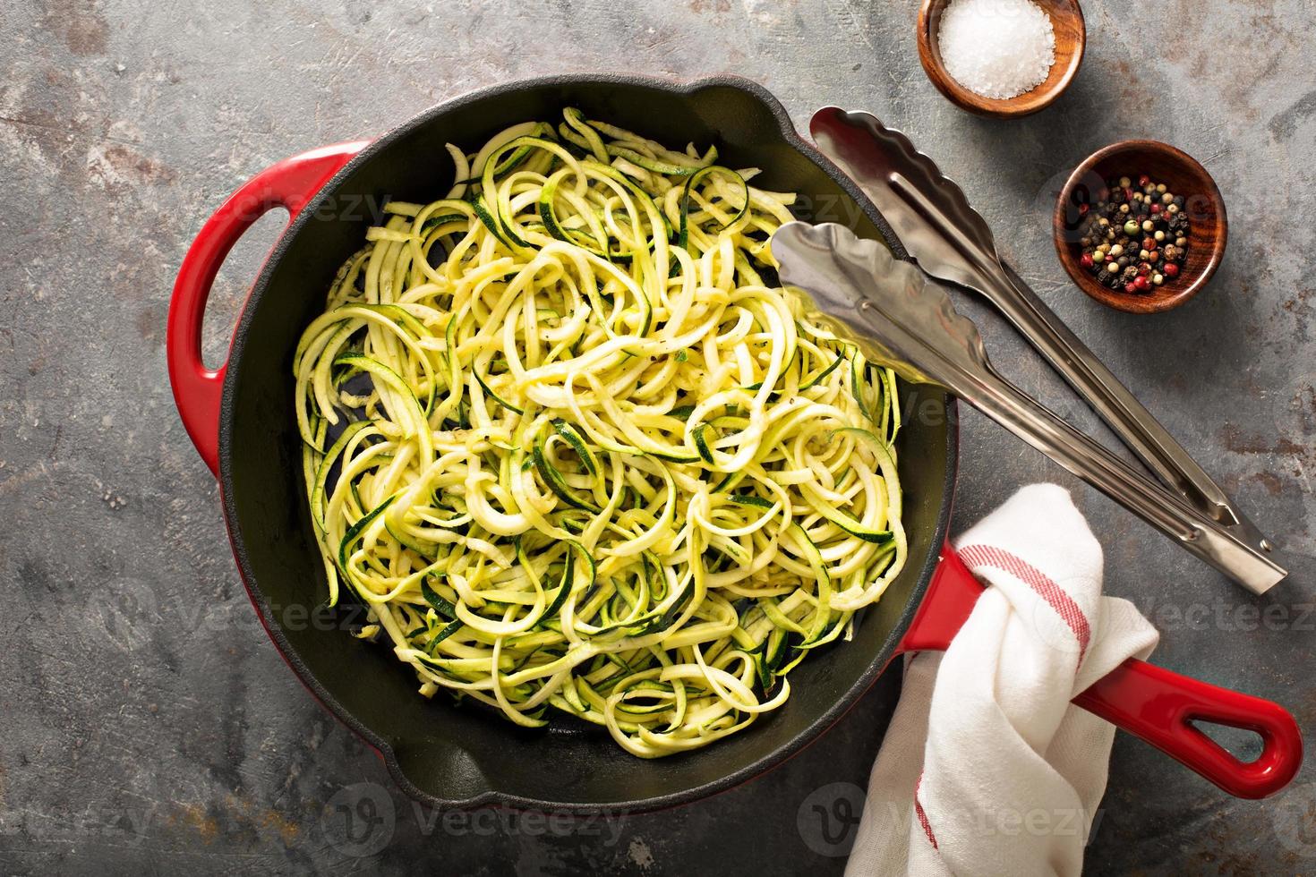Spiralized zucchini noodles in a cast iron pan photo