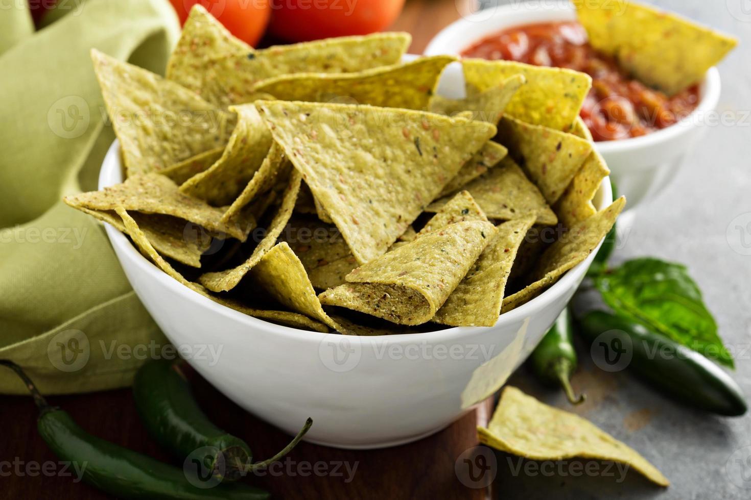 Healthy corn tortilla chips with spinach and flax seeds photo