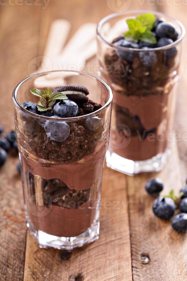 Chocolate pudding parfait with cookie crumbs photo