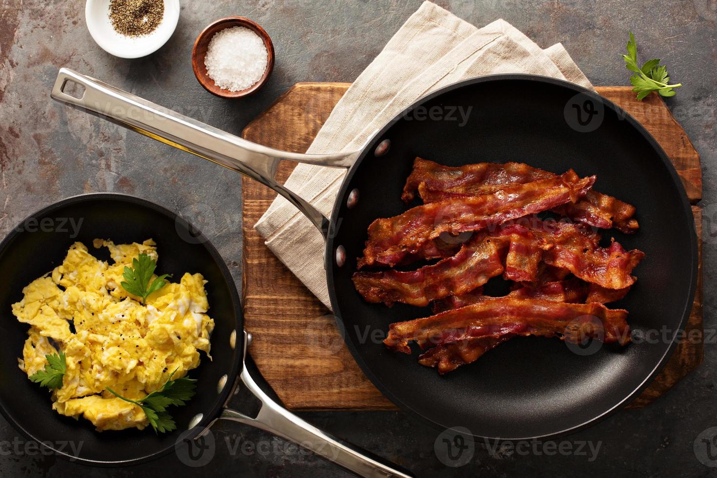 Cooked bacon on a skillet photo