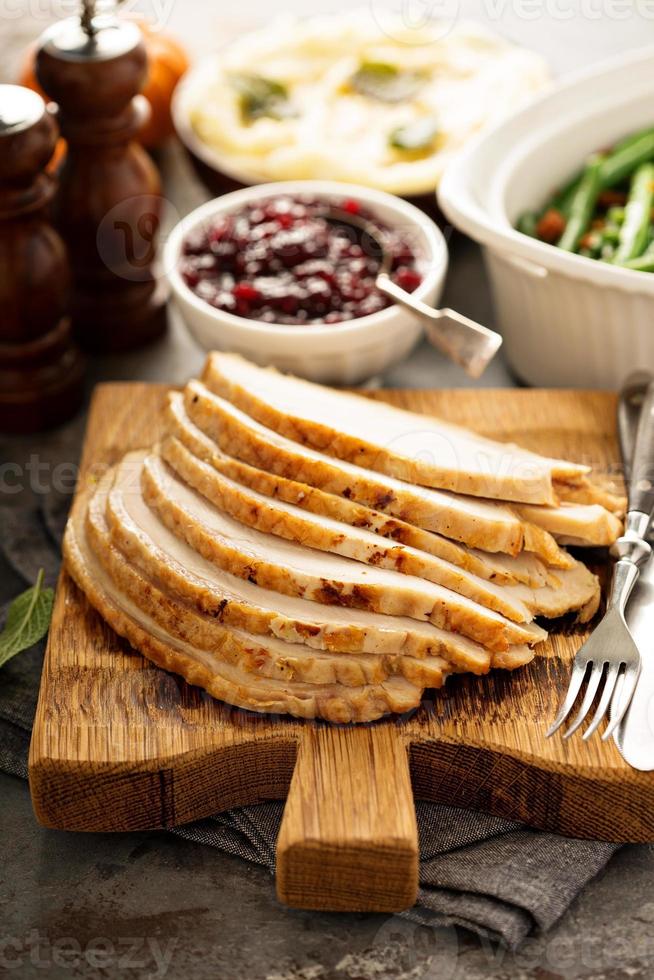 Sliced roasted turkey breast for Thanksgiving or Christmas photo