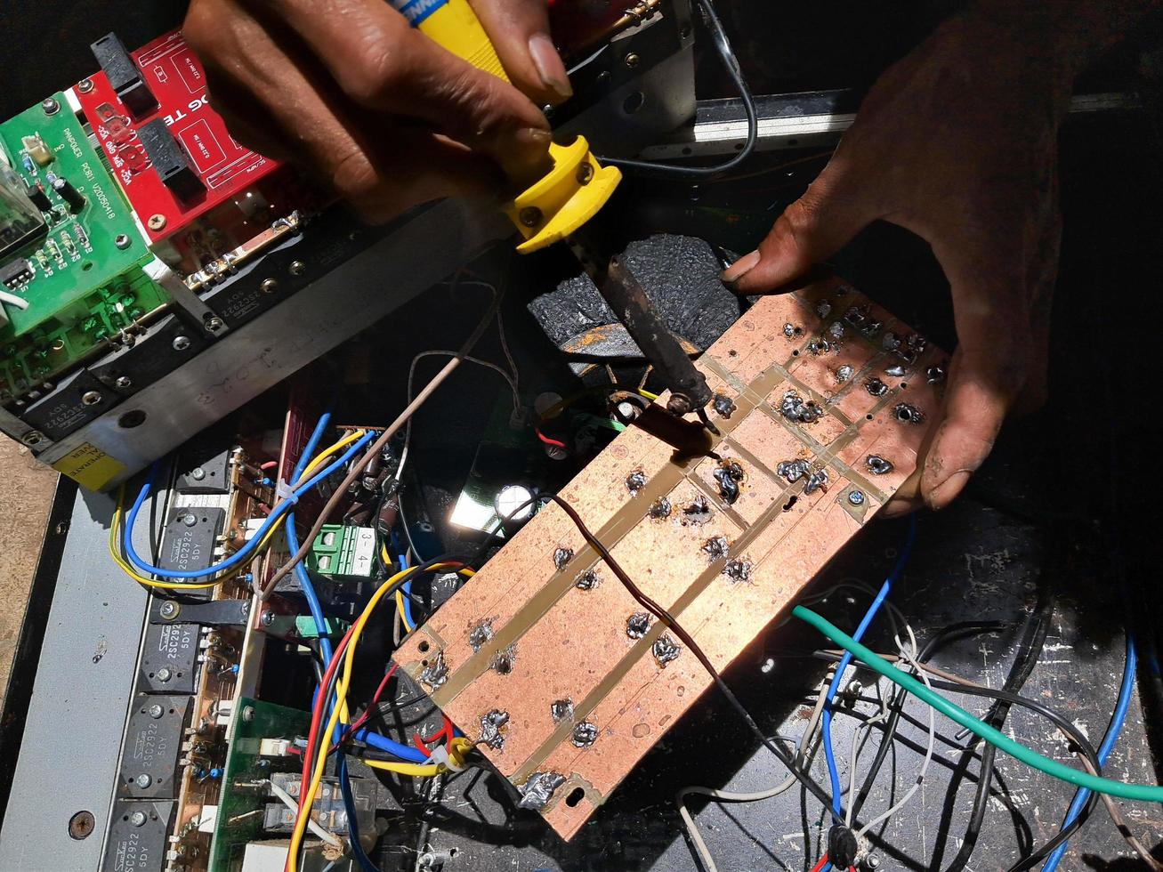 electronics mechanic setting up the amplifier photo