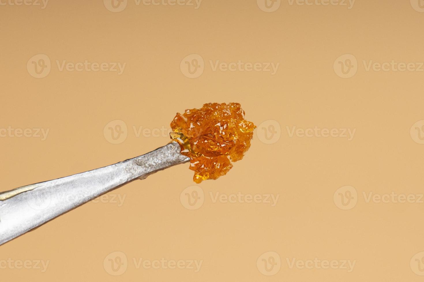 cannabis golden fresh live resin wax with high thc for stoner smoke. thc butane extract photo