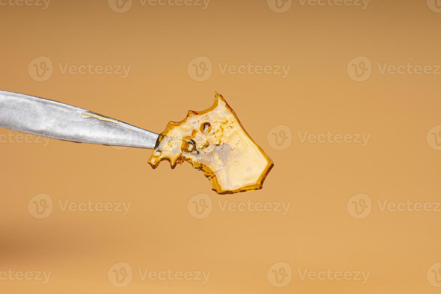 cannabis butane extraction, golden shatter with high thc content photo