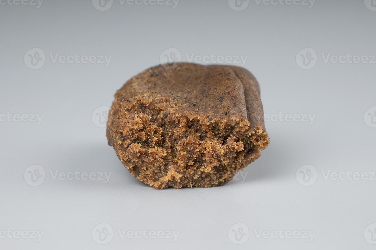 high thc cannabis, concentrate marijuana in the form of hashish amber trichomes on dark background photo