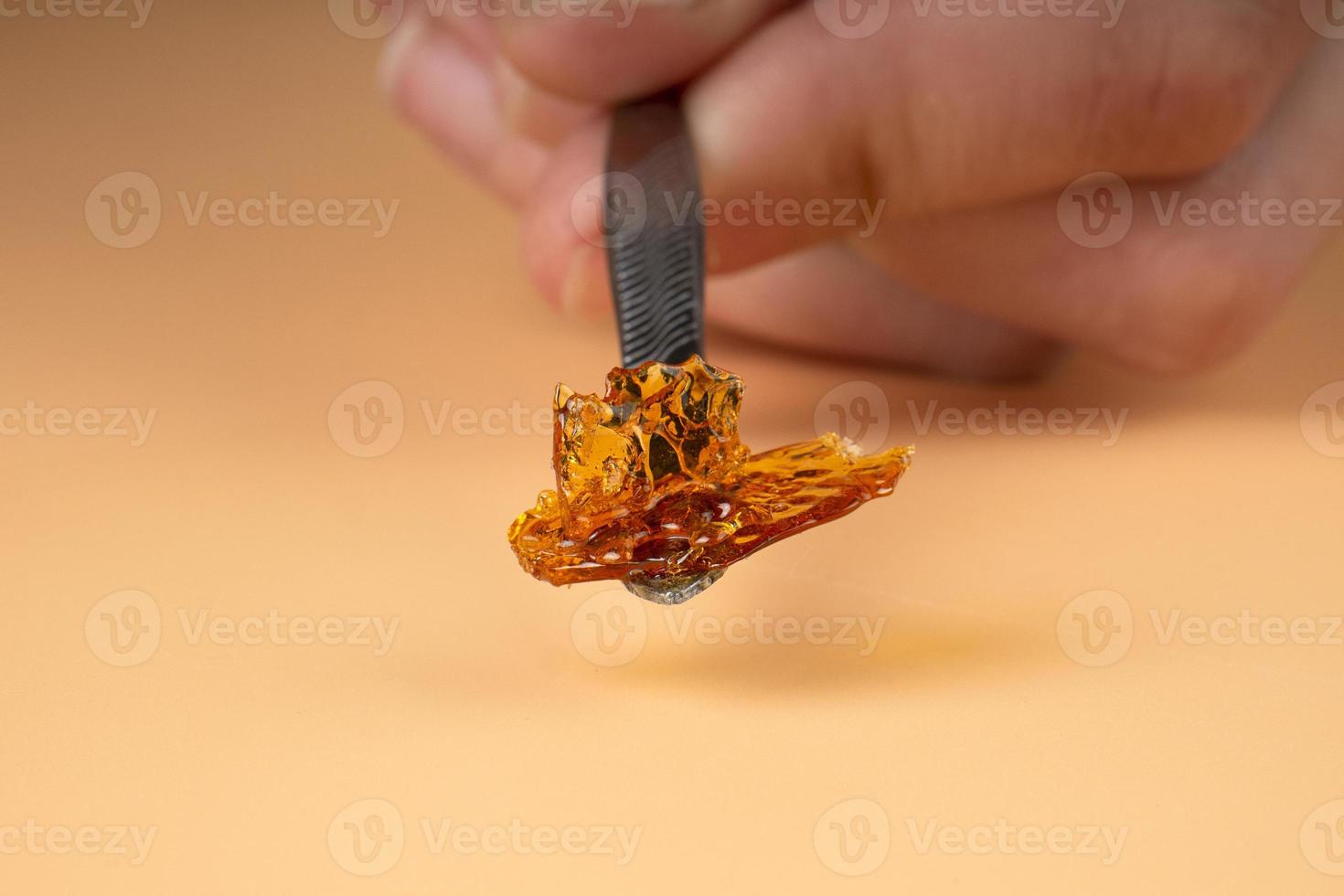 cannabis golden fresh live resin wax with high thc for stoner smoke. thc butane extract photo