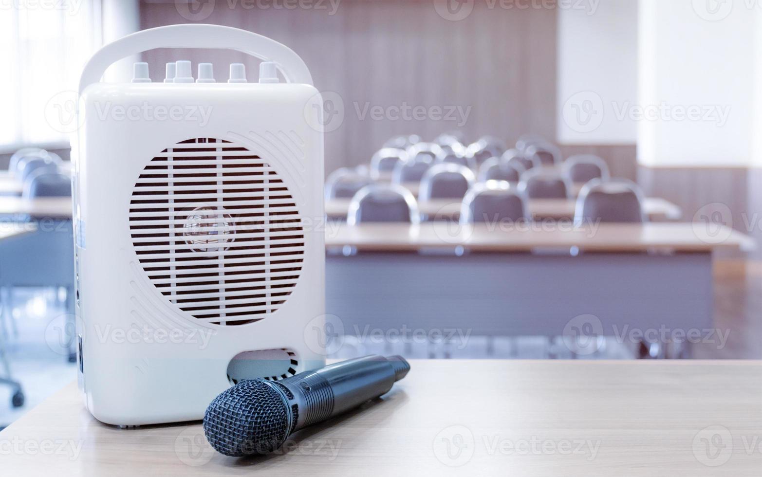 Pocket amplifiers and microphones placed on the table in front of the classroom. photo
