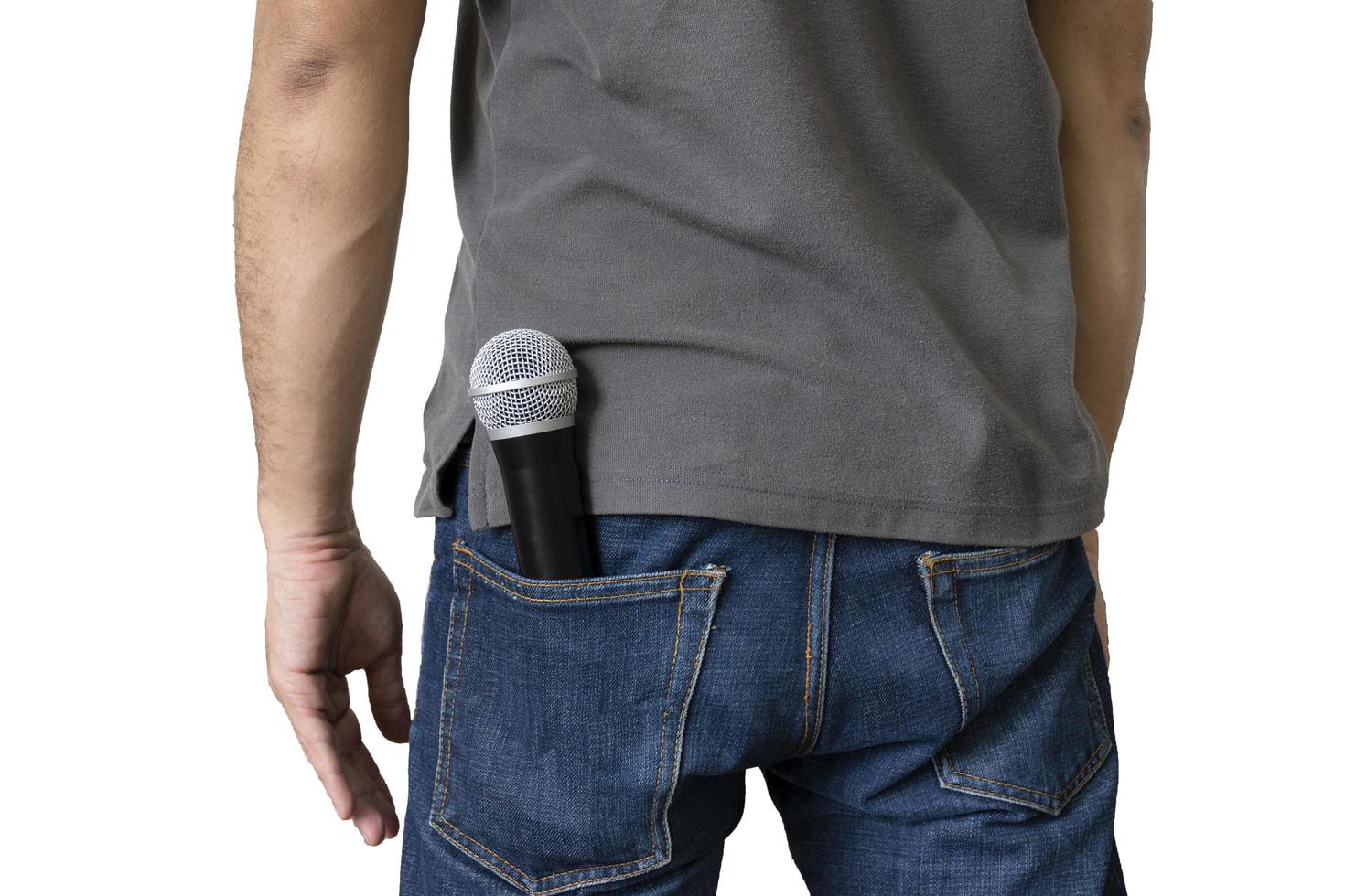 Microphone is in the back pocket of the jeans on white background and clipping path photo