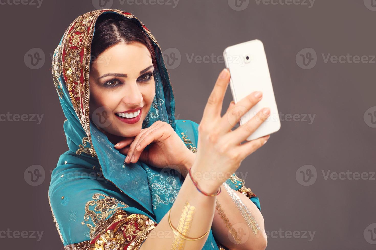 Arabic woman using smartphone photo