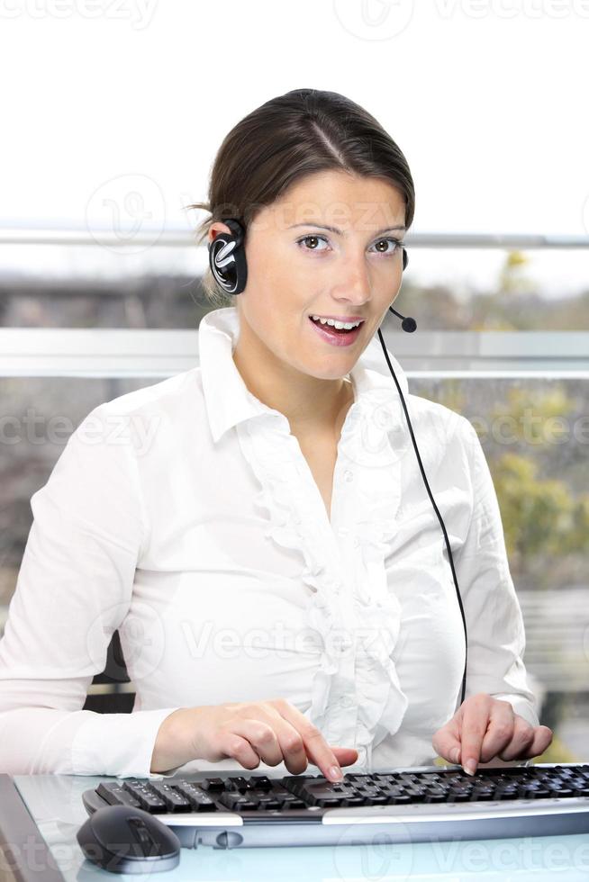 Beautiful woman in a call center photo