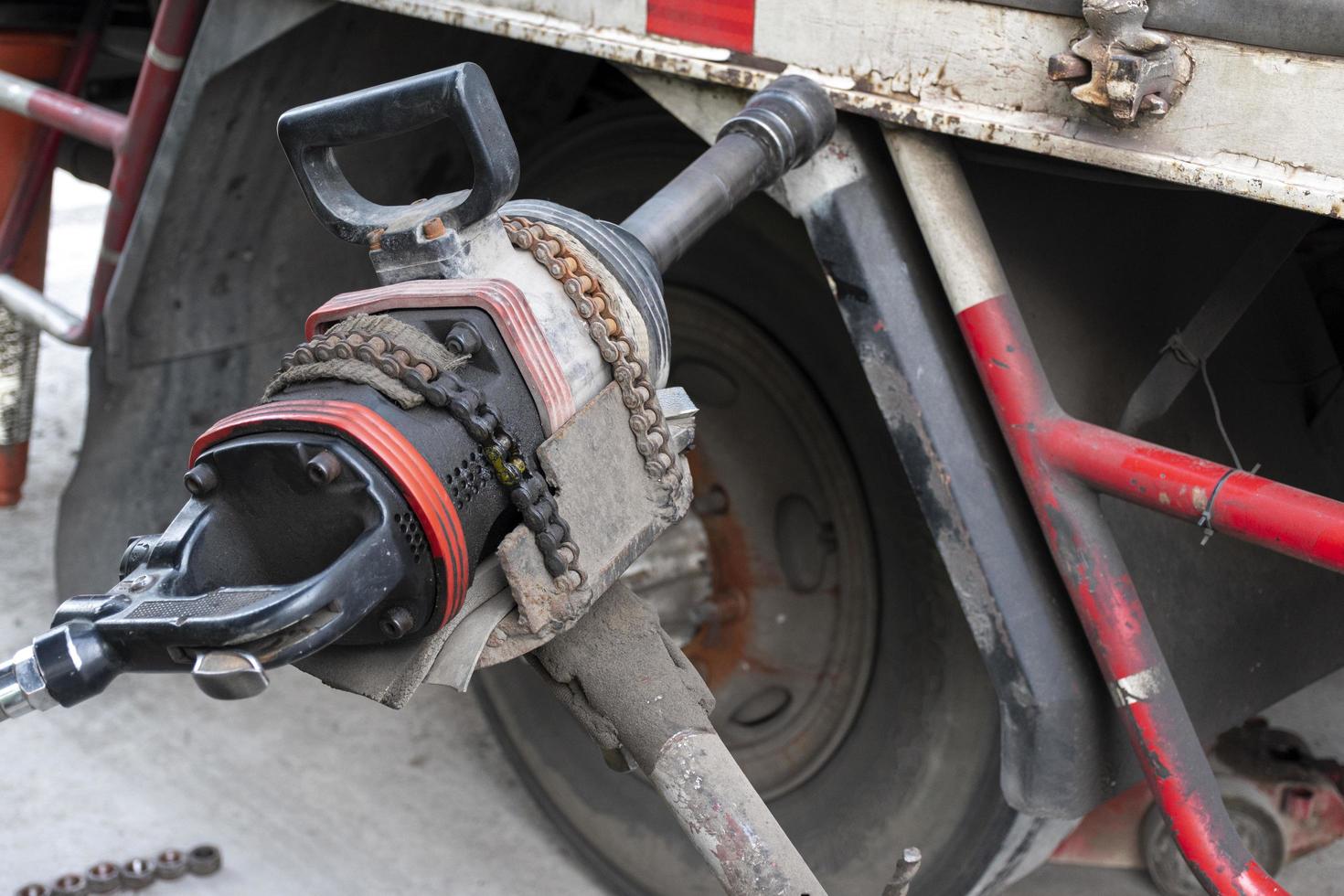 Close up air impact wrench for removing wheel nuts. photo