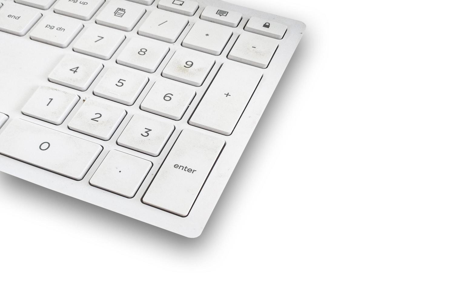 Close up Plastic Keyboard on a white background. photo