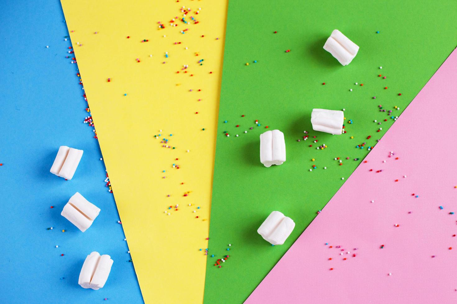 Colored marshmallow composition on on colorful background. Flat lay, holiday concept photo