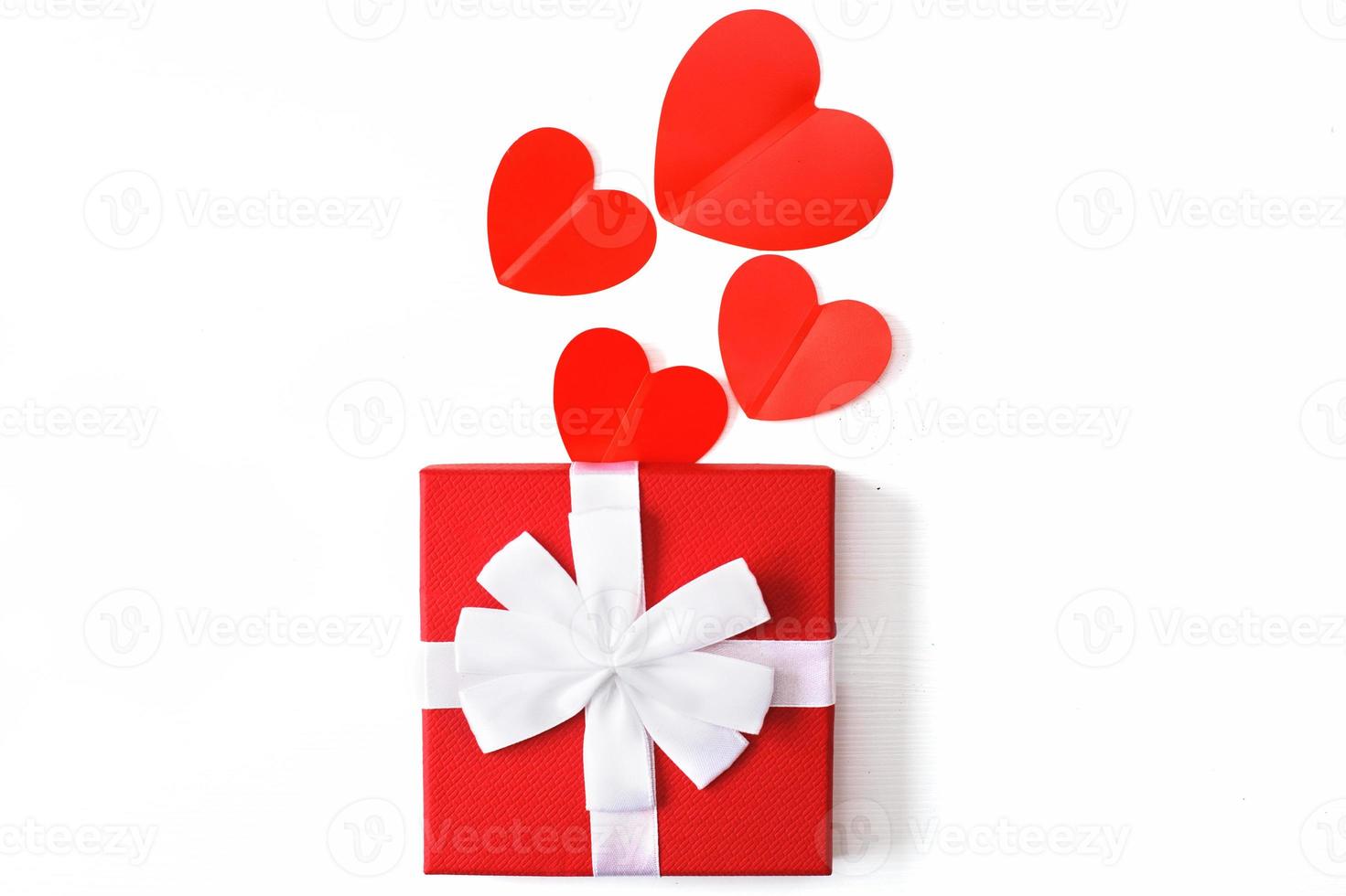 gift box with red hearts on a white background. greeting card photo