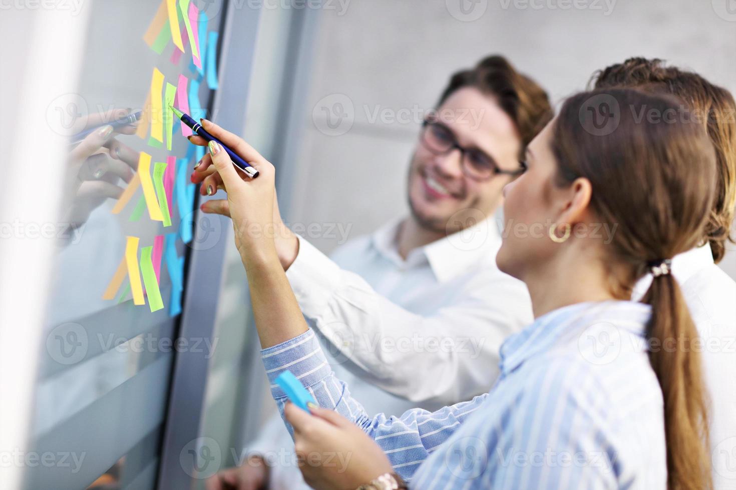 Group of business people brainstorming their ideas photo