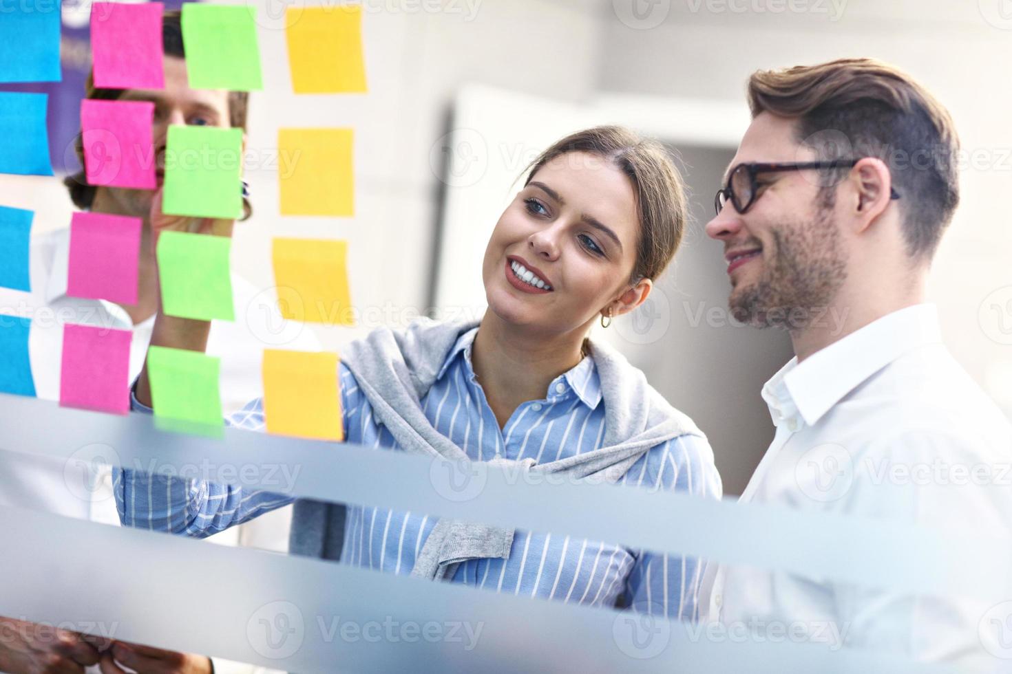 Group of business people brainstorming their ideas photo