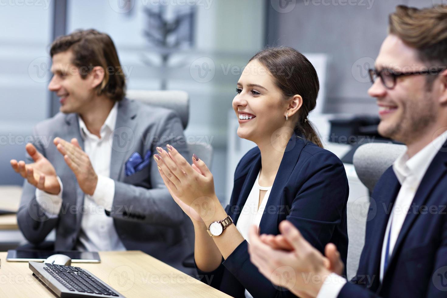 Group of business people attending a conference photo