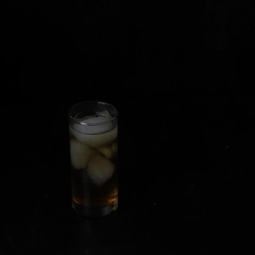 Ice tea isolated on black background photo