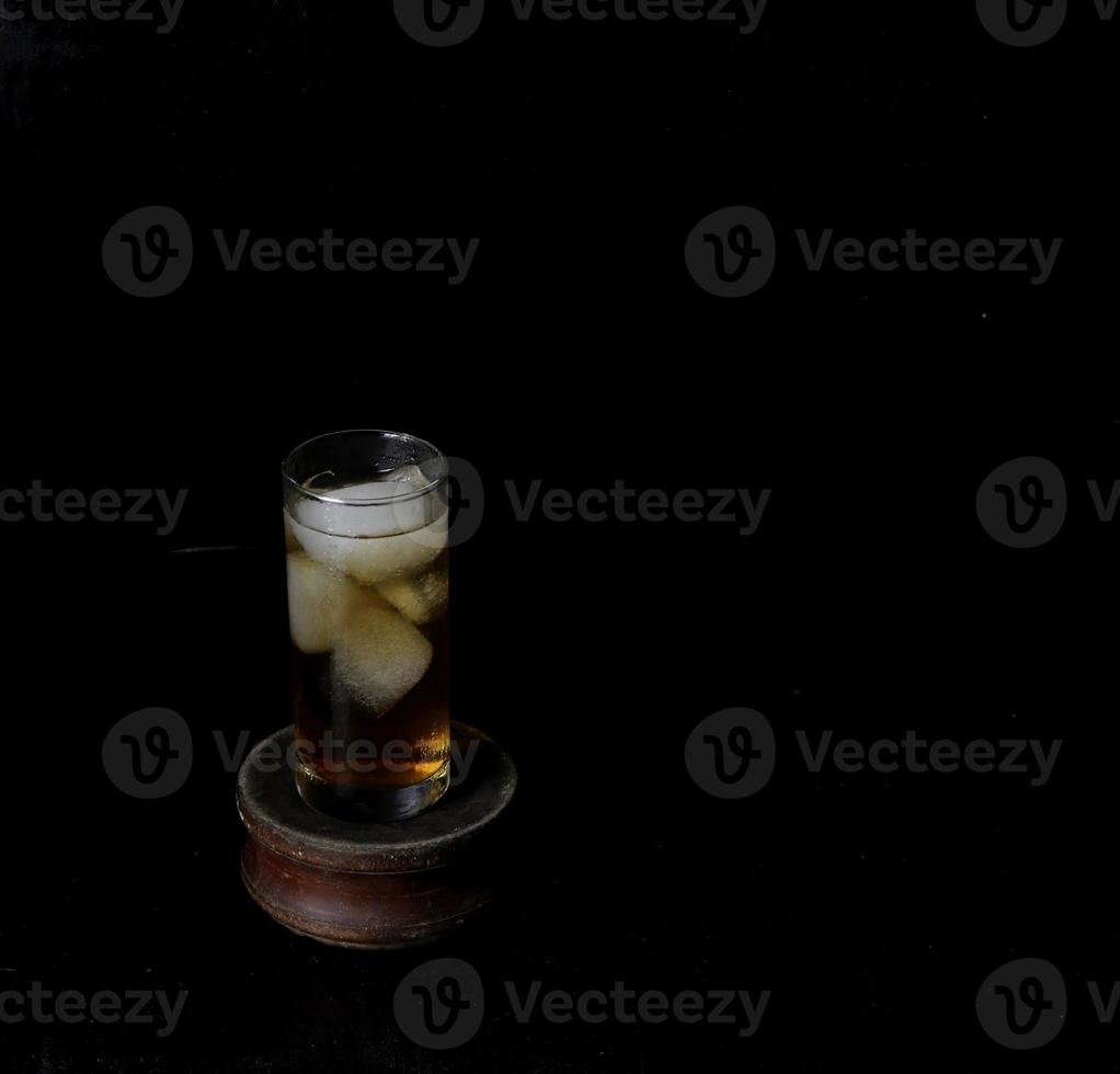 Ice tea isolated on black background photo