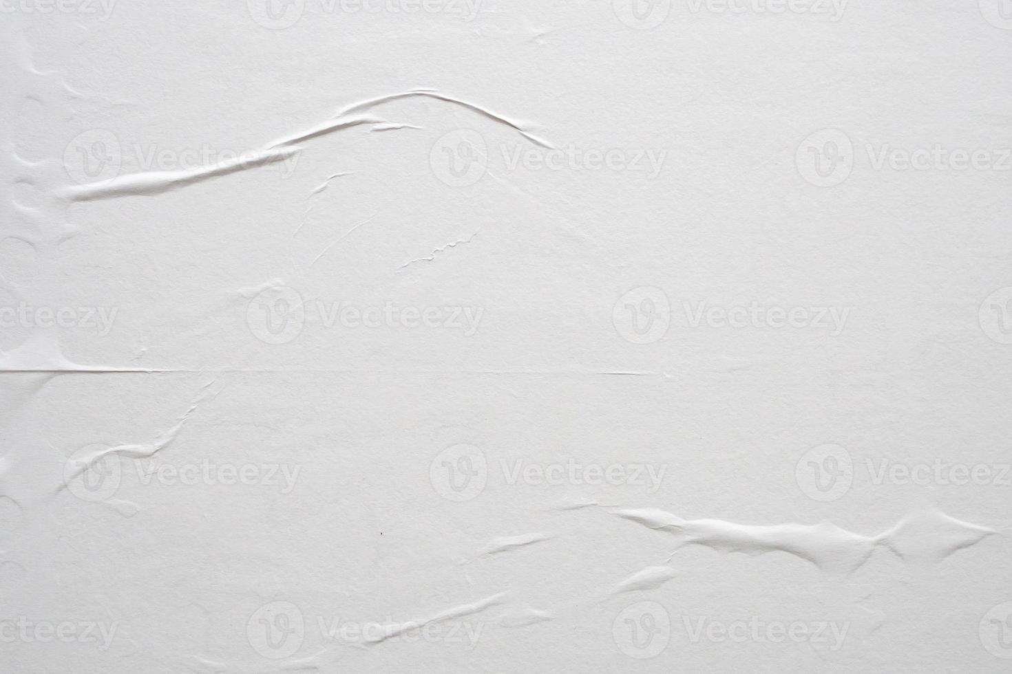 white crumpled and creased paper poster texture background photo