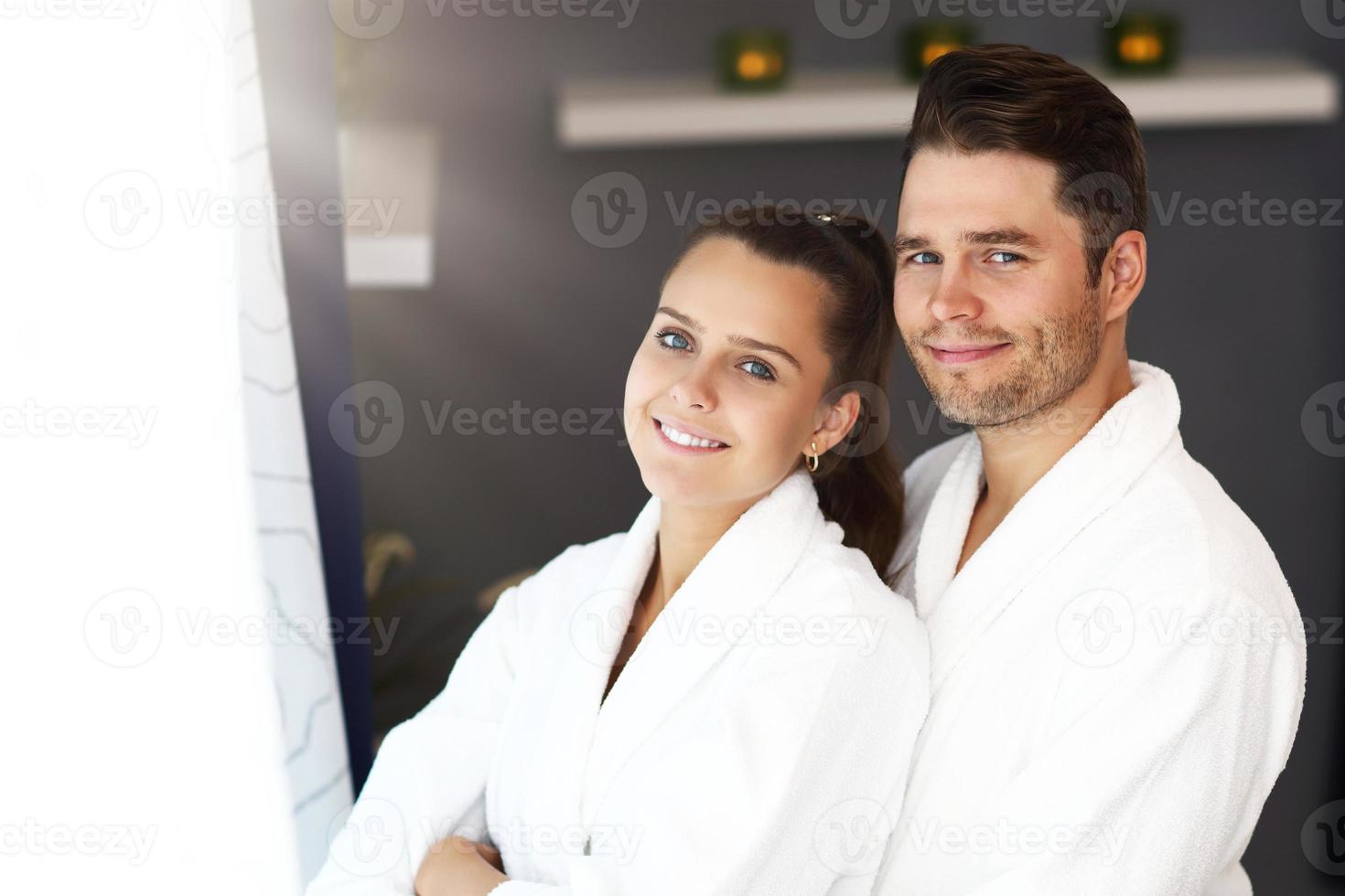 Adult happy couple relaxing in spa salon photo