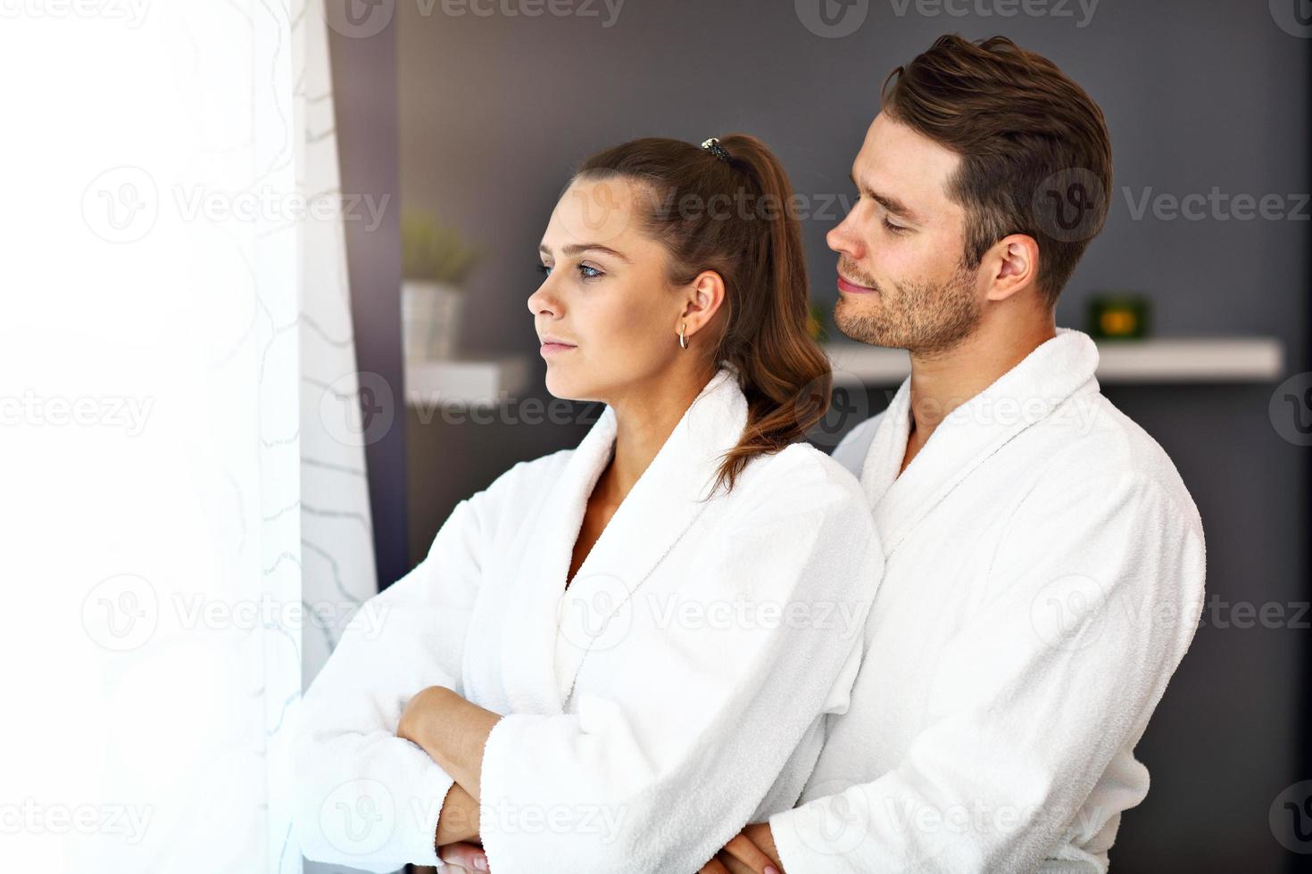 Adult happy couple relaxing in spa salon photo