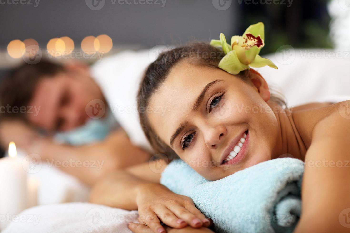 Adult happy couple relaxing in spa salon photo