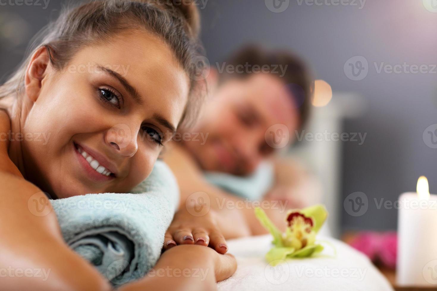 Adult happy couple relaxing in spa salon photo