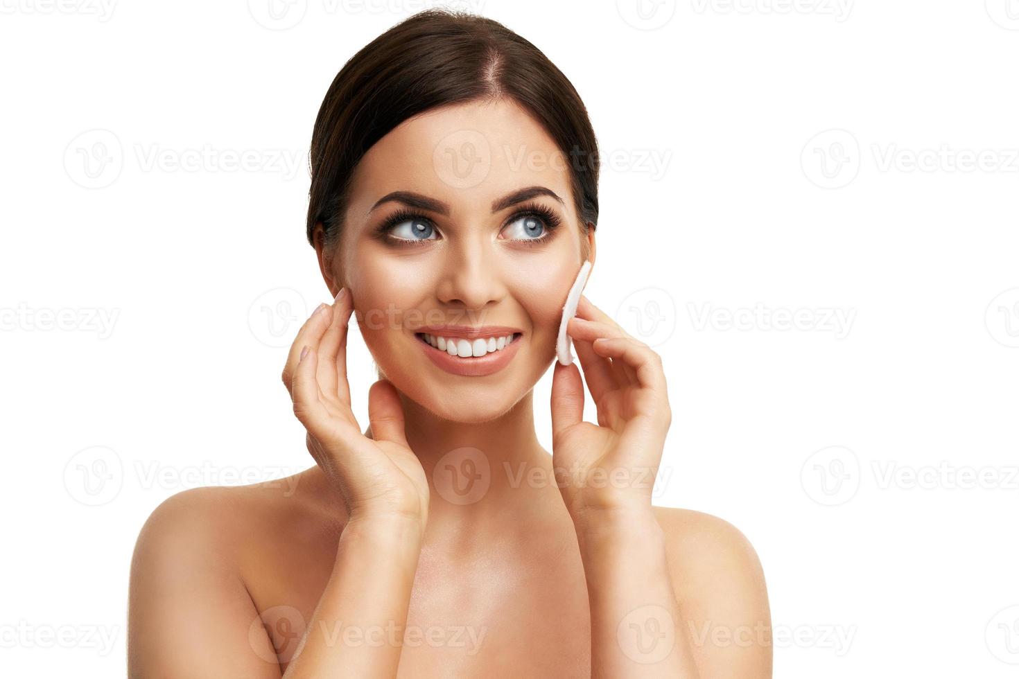Beautiful woman face close up studio on white photo